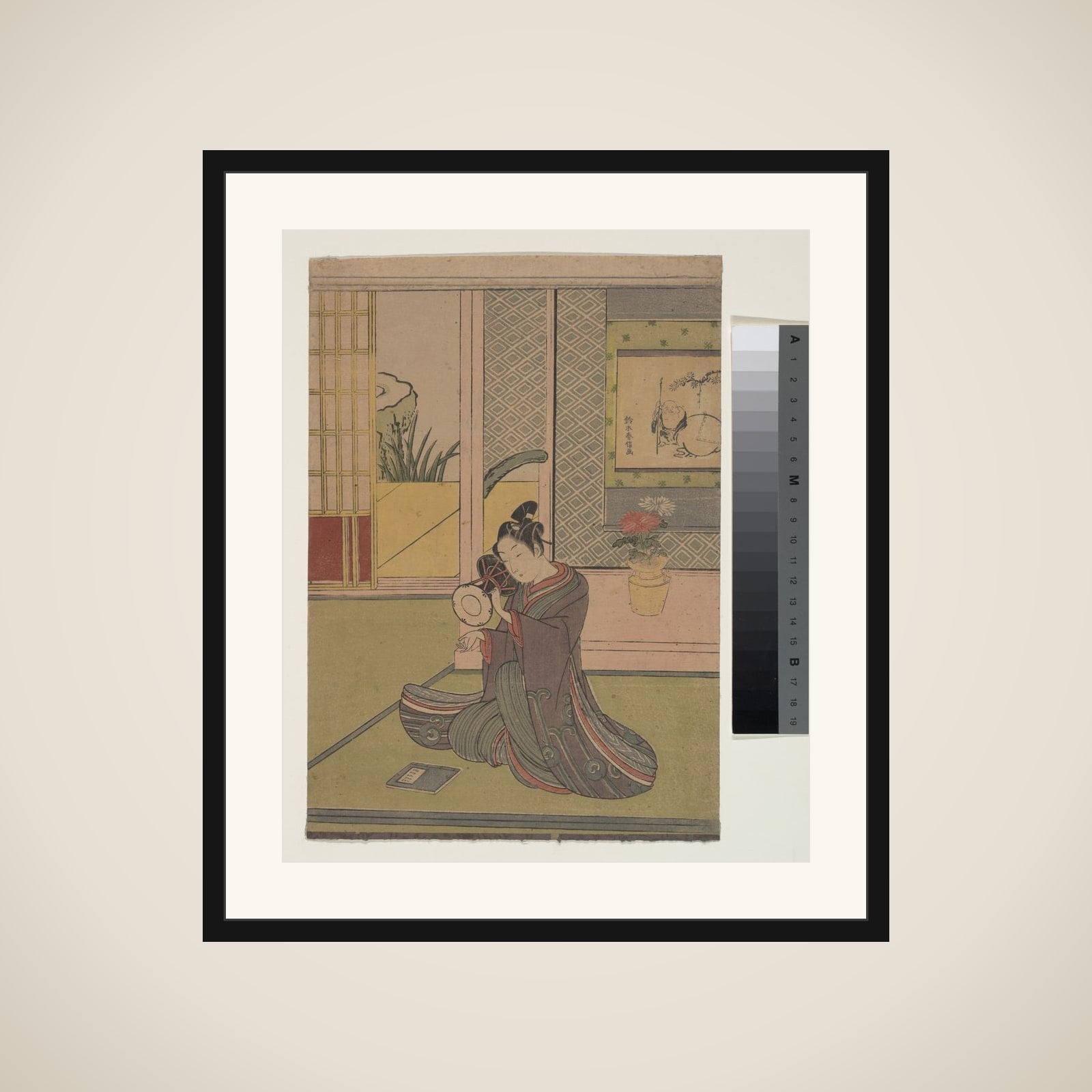 Young Man Playing a Noh Drum framed