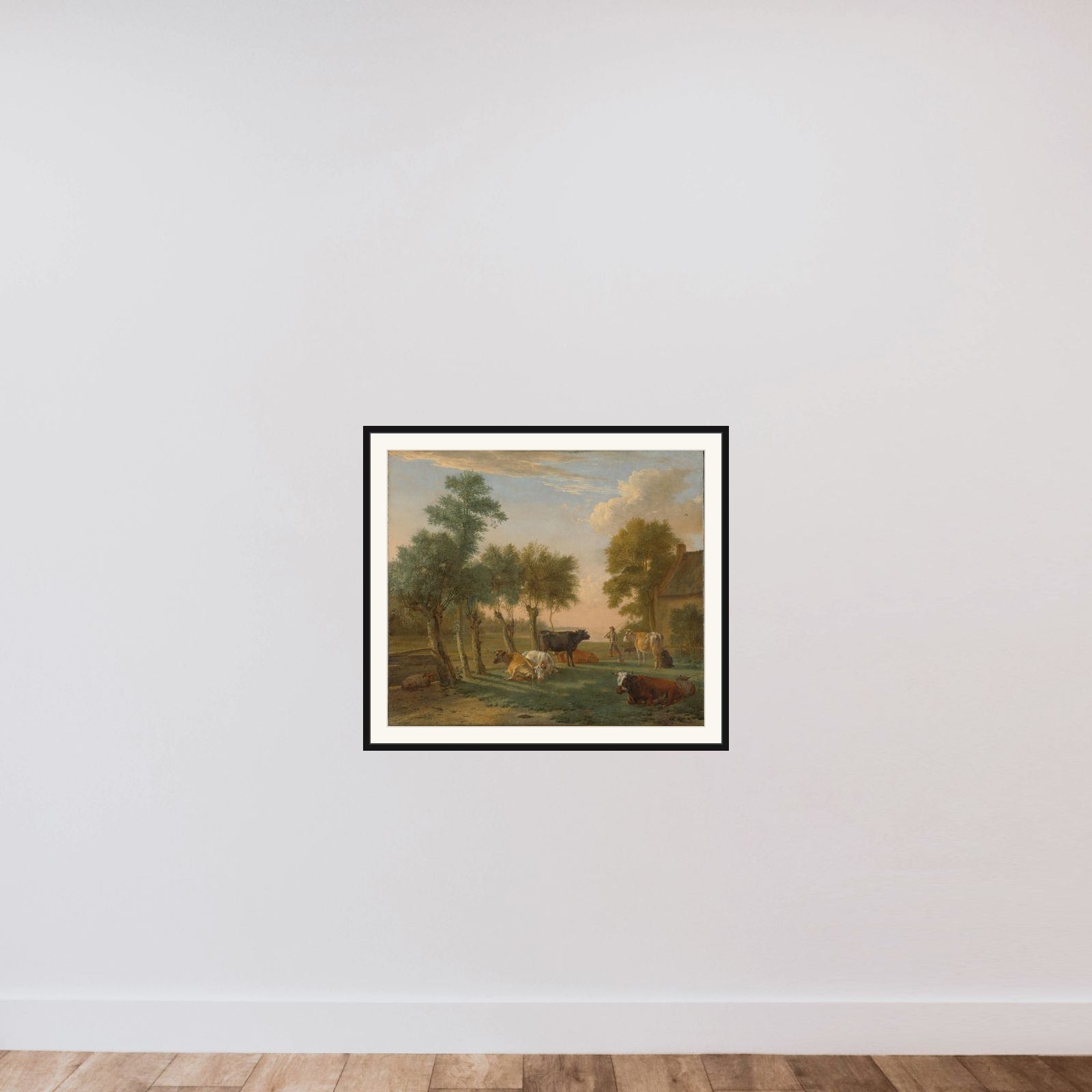 Cows in a meadow near a farm framed — shown to scale