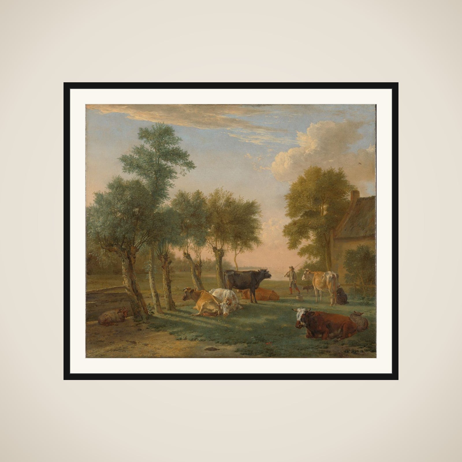 Cows in a meadow near a farm framed