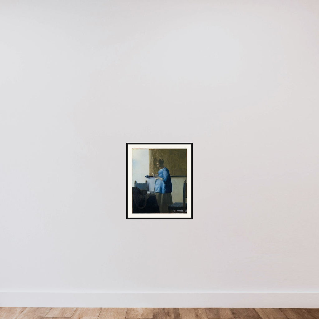 Woman in Blue Reading a Letter framed — shown to scale
