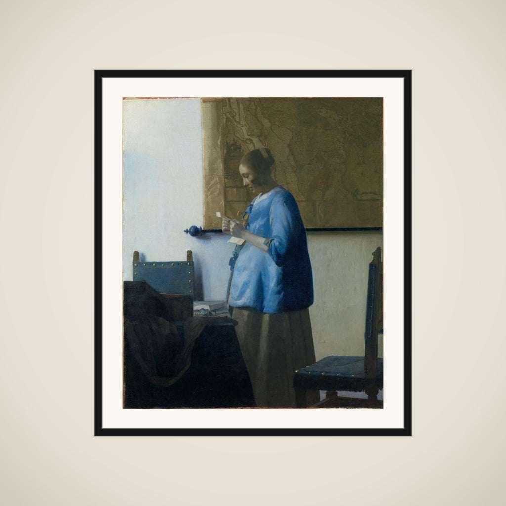 Woman in Blue Reading a Letter framed