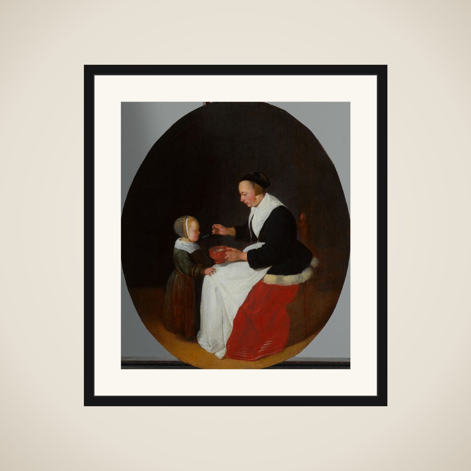 A Mother Feeding Porridge to her Child framed