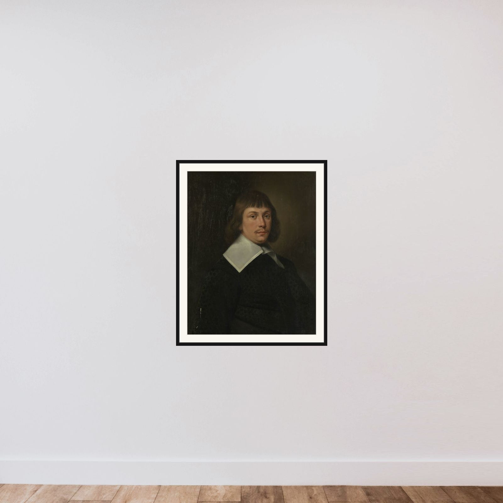 Portrait of a man framed — shown to scale