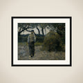 A Farmer standing near a Hay-Stack framed