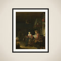 Interior with a man reading and a woman spinning yarn framed