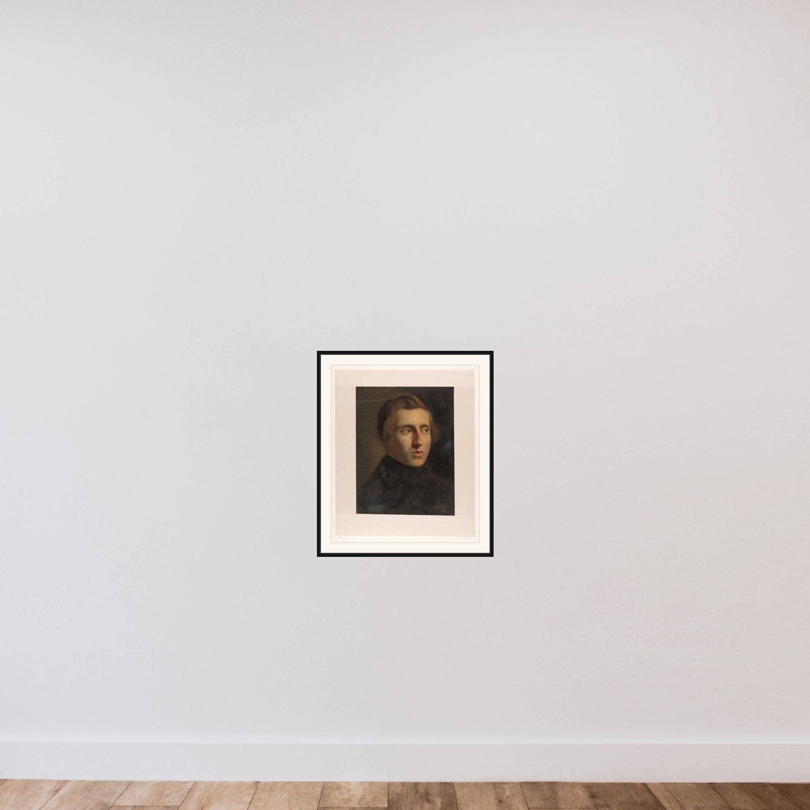 Portrait of een young man framed — shown to scale