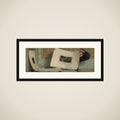 Anna Leafing Through a Portfolio of Prints framed