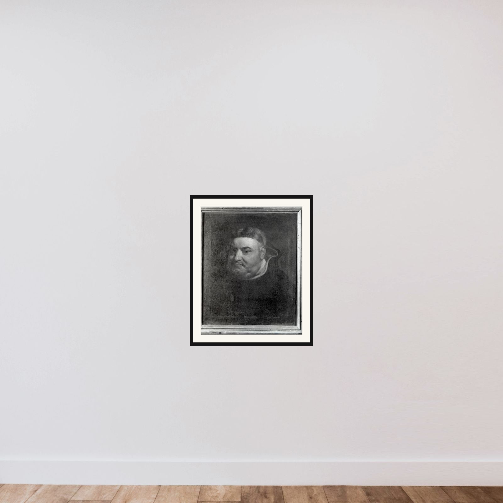 En munk framed — shown to scale