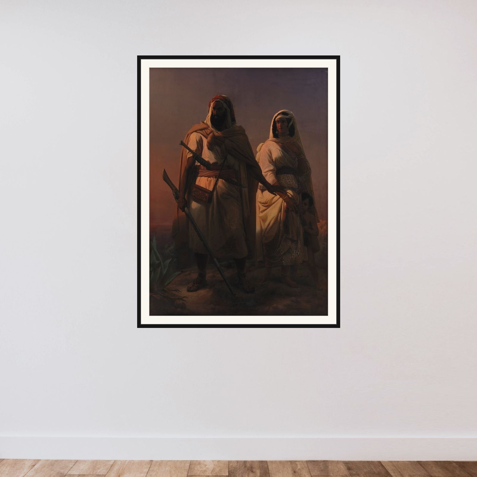 En arabisk familie i ørkenen framed — shown to scale