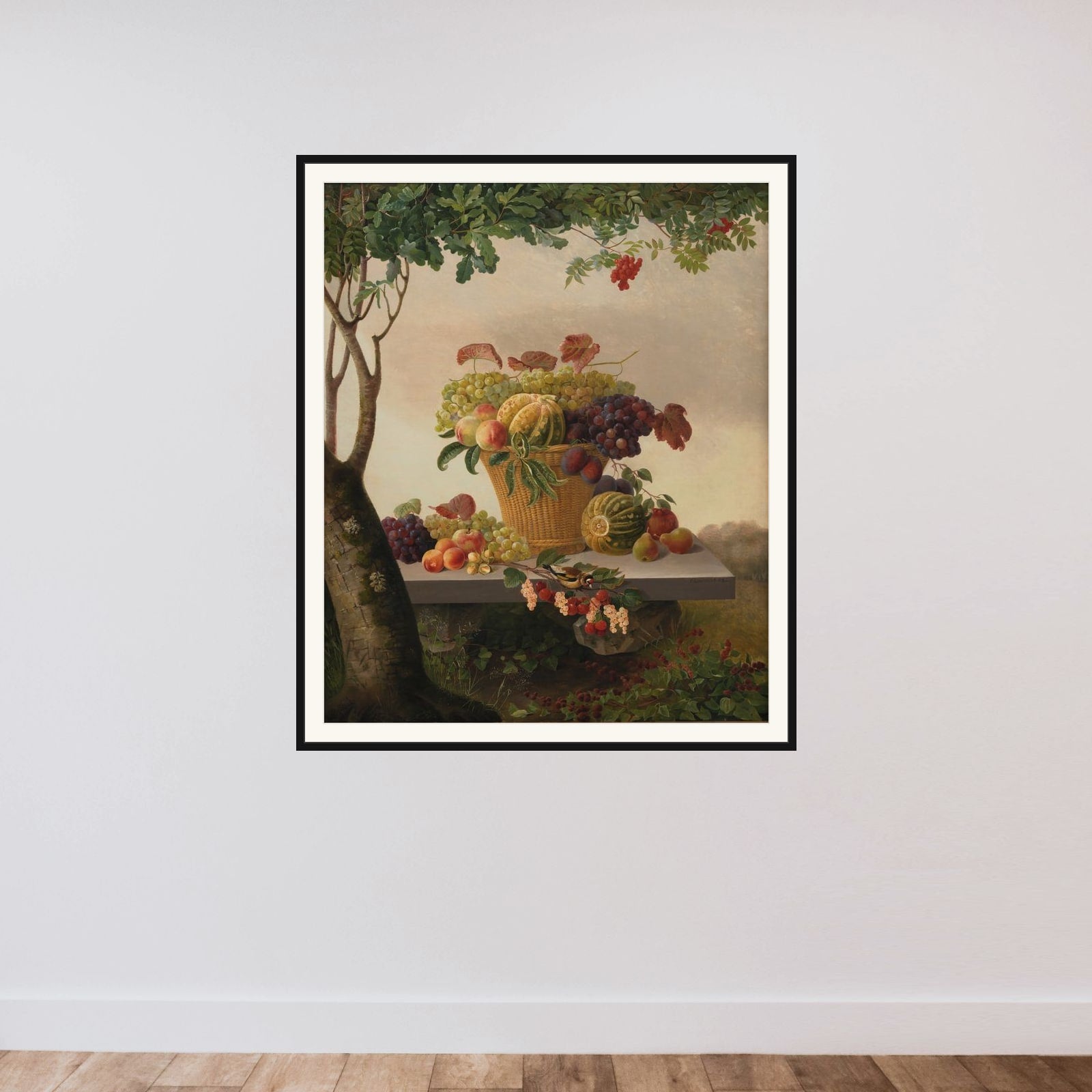 En kurv med frugter i et landskab framed — shown to scale