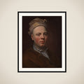 Portræt af en ung mand med hvid hue på hovedet framed