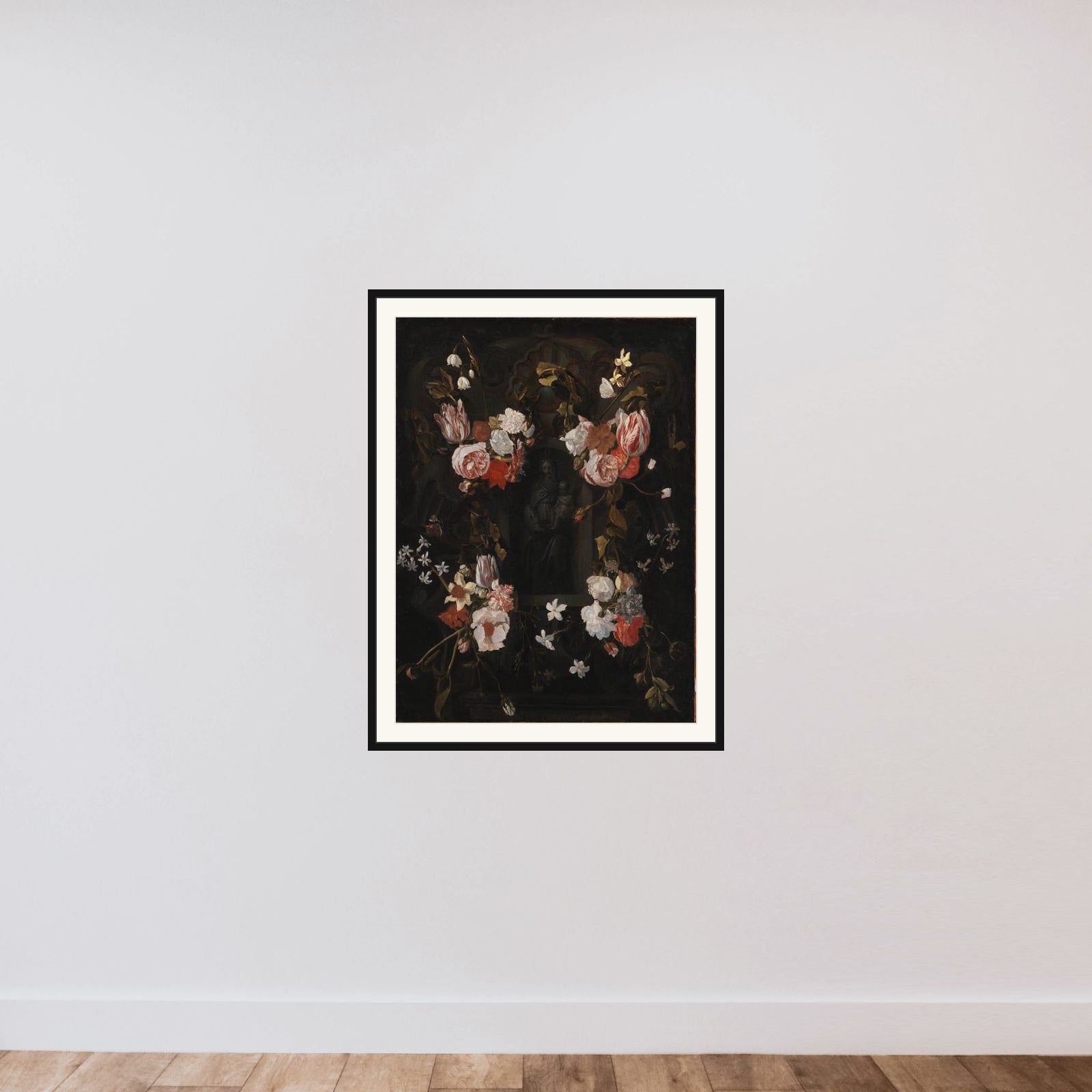 En blomsterkranset niche med en stenfigur af Madonna framed — shown to scale