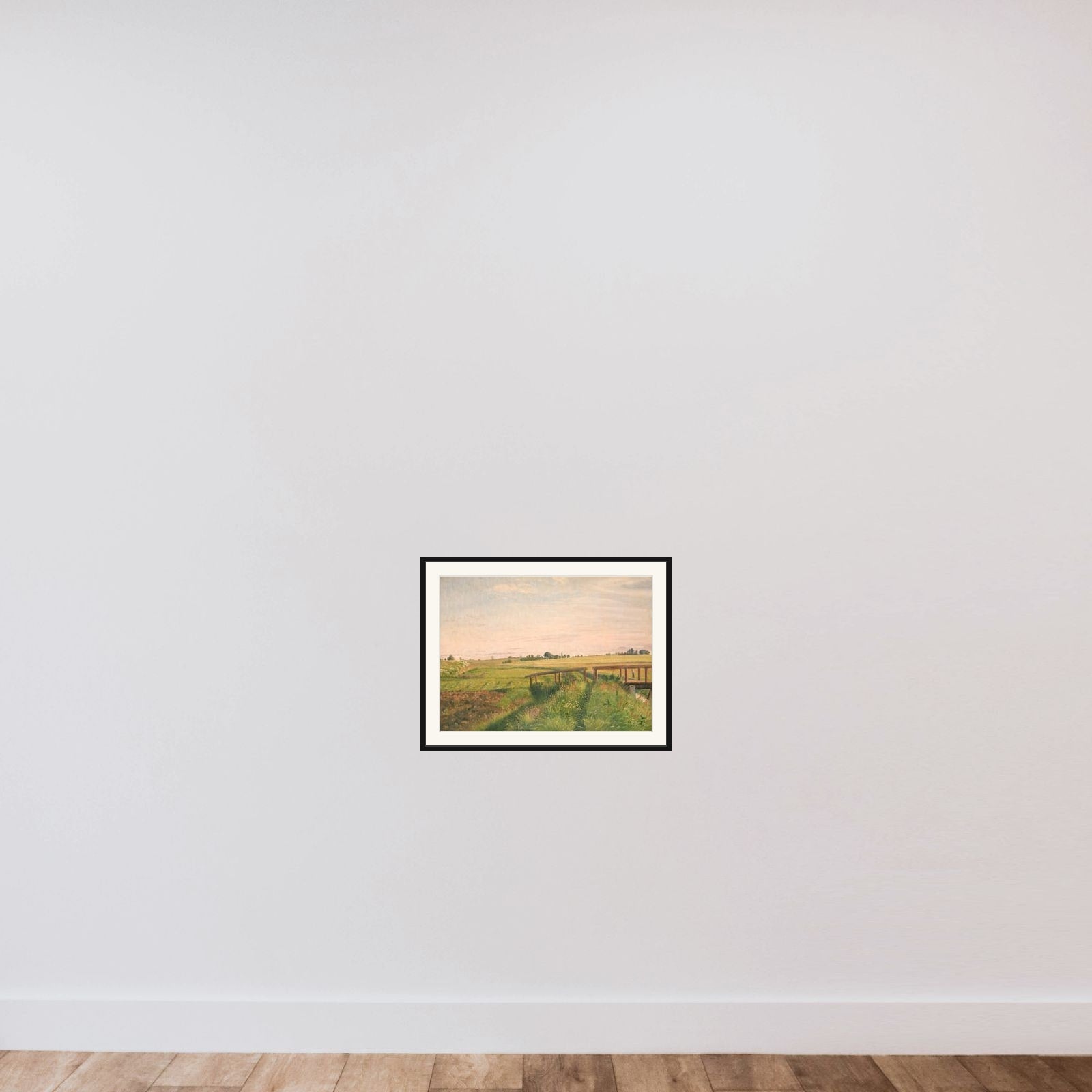 Marklandskab med en bro framed — shown to scale