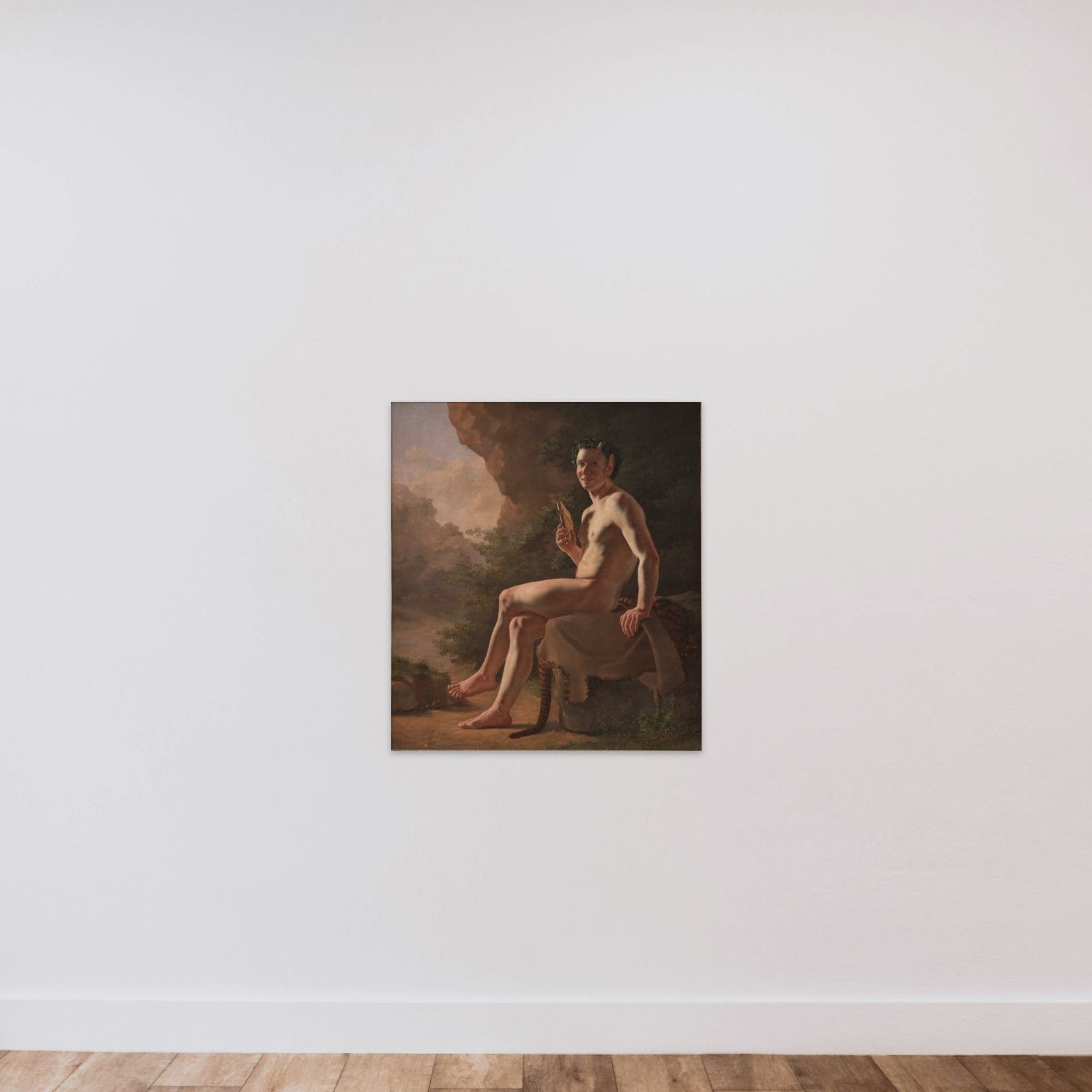 Ung Pan i en grotte. Modelfigur unframed — shown to scale