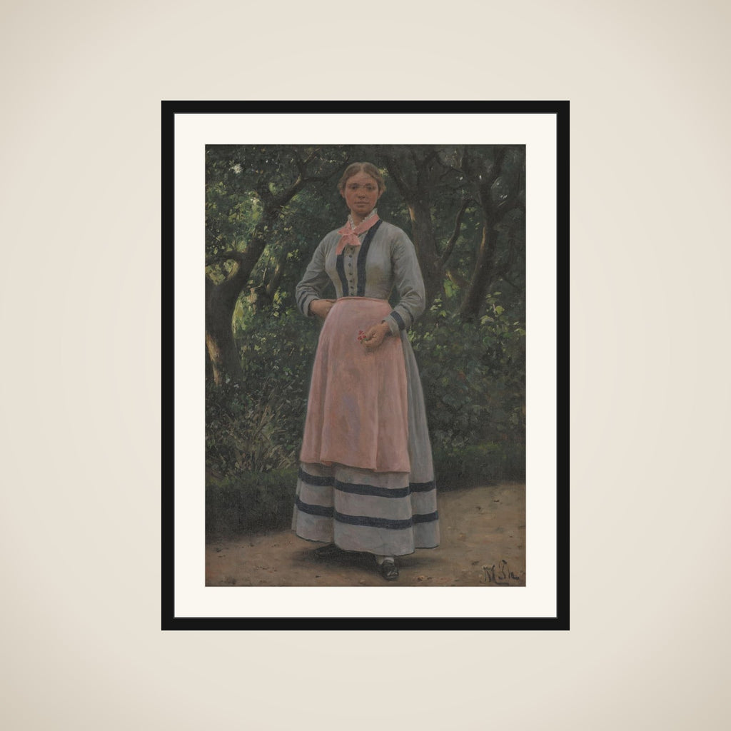 Ung pige i en have framed
