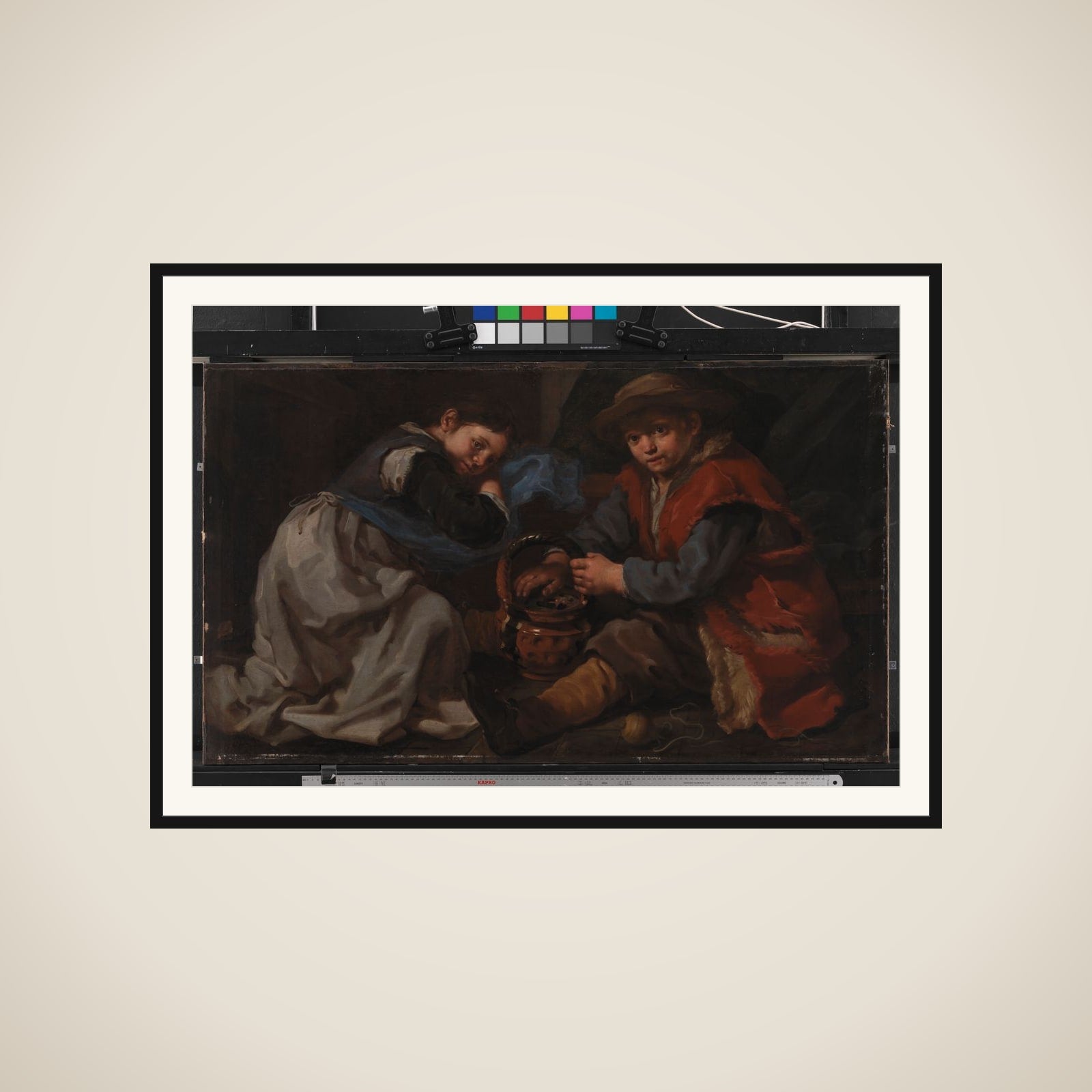 En pige og en dreng, der varmer sig ved et kulbækken framed