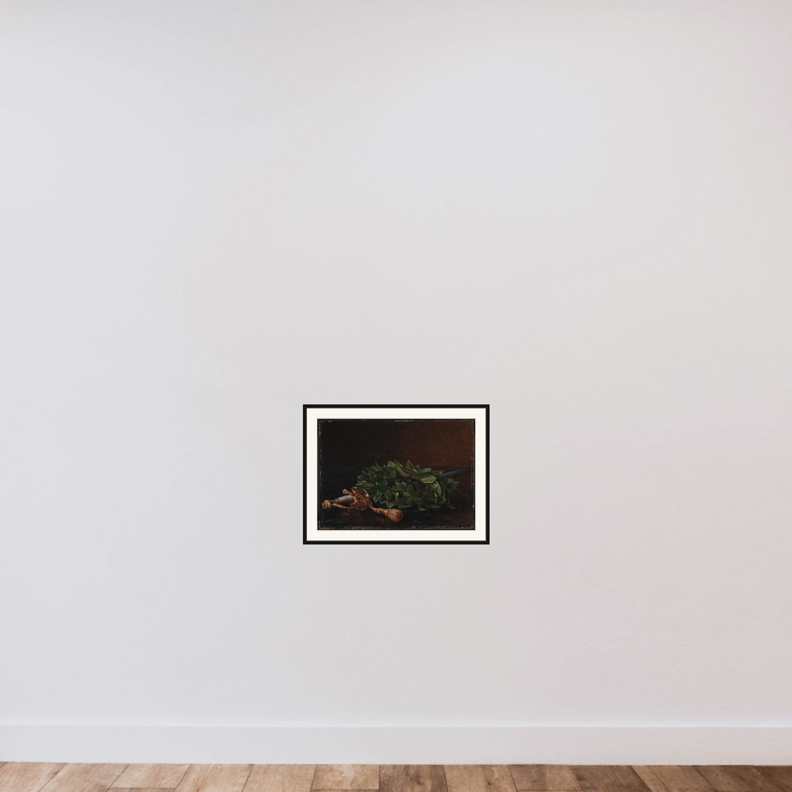 En kårde med laurbærkrans framed — shown to scale