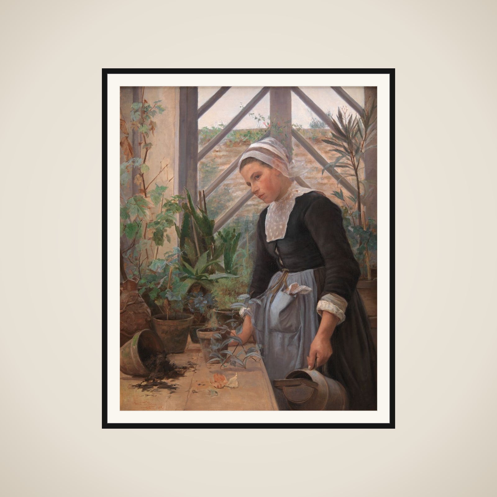 Bretagne-pige ordner planter i et drivhus framed