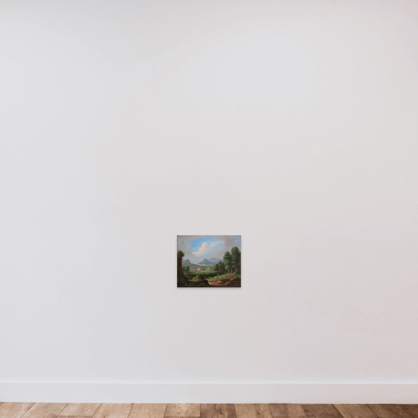 Et landskab med villaer i mellemgrunden og bjerge i baggrunden unframed — shown to scale